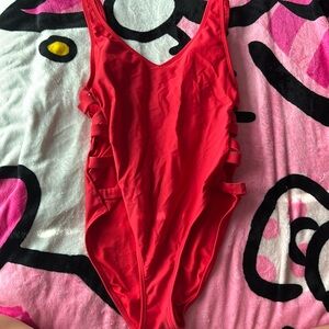 brand: xhilaration, color: red, size: Medium.